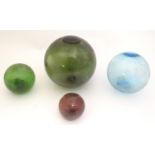 4 various glass fishing floats of spherical form. the largest approx 4 1/2" diameter Please Note -