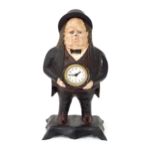 A novelty clock modelled as John Bull with quartz movement. Approx. 15 1/2" high Please Note - we do