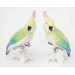 A pair of ceramic models of cockatoo birds by Crown Staffordshire, marked under designed and