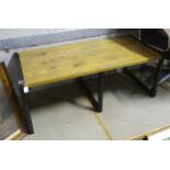 A modern coffee table with metal supports. Approx. 43 1/2" long Please Note - we do not make