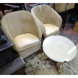 Two wicker armchairs, together with an occasional table (3) Please Note - we do not make reference