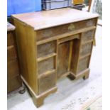 A mahogany knee hole desk with a moulded top above a single long drawer above two banks of two short