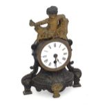 A late 19th / early 20thC cast mantel clock surmounted by a cherub. Approx. 11" high x 8" wide x