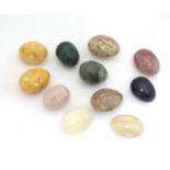 A quantity of hardstone eggs. Largest approx 2 3/4" long Please Note - we do not make reference to