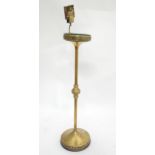 A 20thC brass smokers compendium / ashtray on stand with matchbox holder. Approx. 34" high Please