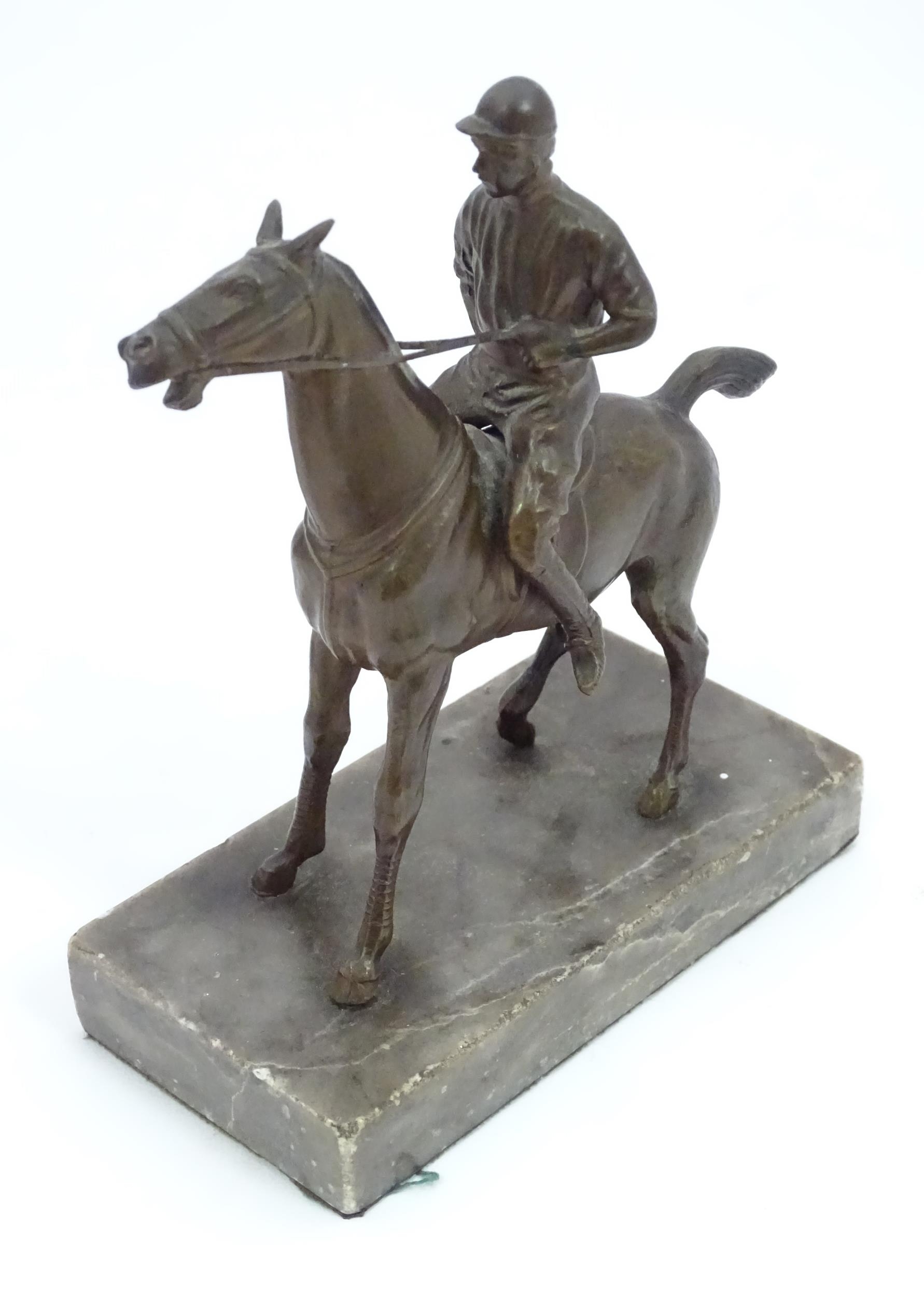 A 20thC cast sculpture modelled as a jockey on horseback, upon a marble base. Approx. 5 1/2" high - Image 3 of 5