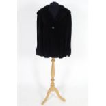 Vintage clothing/ fashion: A Vintage ladies black short corduroy hooded jacket, buttoned to front.