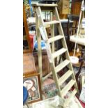 A wooden A-frame step ladder with 7 steps. Approx. 71 1/2" high Please Note - we do not make