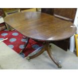 A mid 20thC oak twin pedestal dining table with leaf. Labelled Redman & Hales Ltd - Hatfield