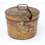 A 19thC tin hat box. Approx. 13 1/2" wide Please Note - we do not make reference to the condition of