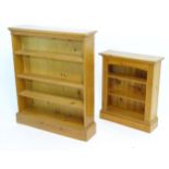 Two pine book cases. Largest approx. 35" wide x 42 1/2" high x 9" deep (2) Please Note - we do not