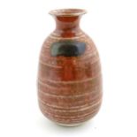 A Japanese studio pottery vase with a flared rim. Impressed character marks under. Approx. 5 3/4"