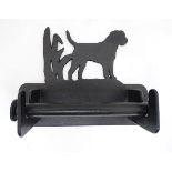 A cast toilet roll holder the bracket with border terrier dog detail. Approx. 8 1/2" wide Please