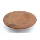 A large terracotta charger with banded foliate detail. Approx. 3 3/4" high x 19 1/2" diameter Please