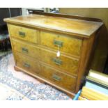 A walnut Arts & Crafts style dressing chest with mirrored back and two over two drawers. Approx. 42"