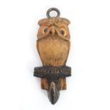 A 20thC Continental carved coat hook with owl / bird decoration. Approx. 4" Please Note - we do