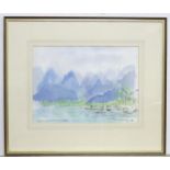 A watercolour depicting an Oriental coastal scene with boats and mountains beyond, signed lower left