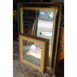 A modern bevelled mirror with gilt and black painted frame, together with a stripped pine framed