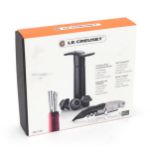 A boxed Le Creuset corkscrew, wine pump and drip free pourer Please Note - we do not make