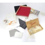 A quantity of postage stamps within an album, together with loose examples, some affixed to