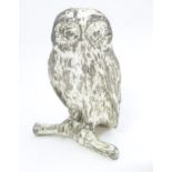 Silver plate model of an owl on a branch. Approx 2 1/2" high Please Note - we do not make