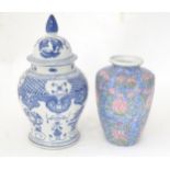 A Chinese blue and white ginger jar decorated with dragons, phoenix birds, flowers, etc. Together