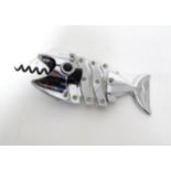 A novelty corkscrew of fish form with a concertina action to body. Approx. 7 1/4" long (closed)