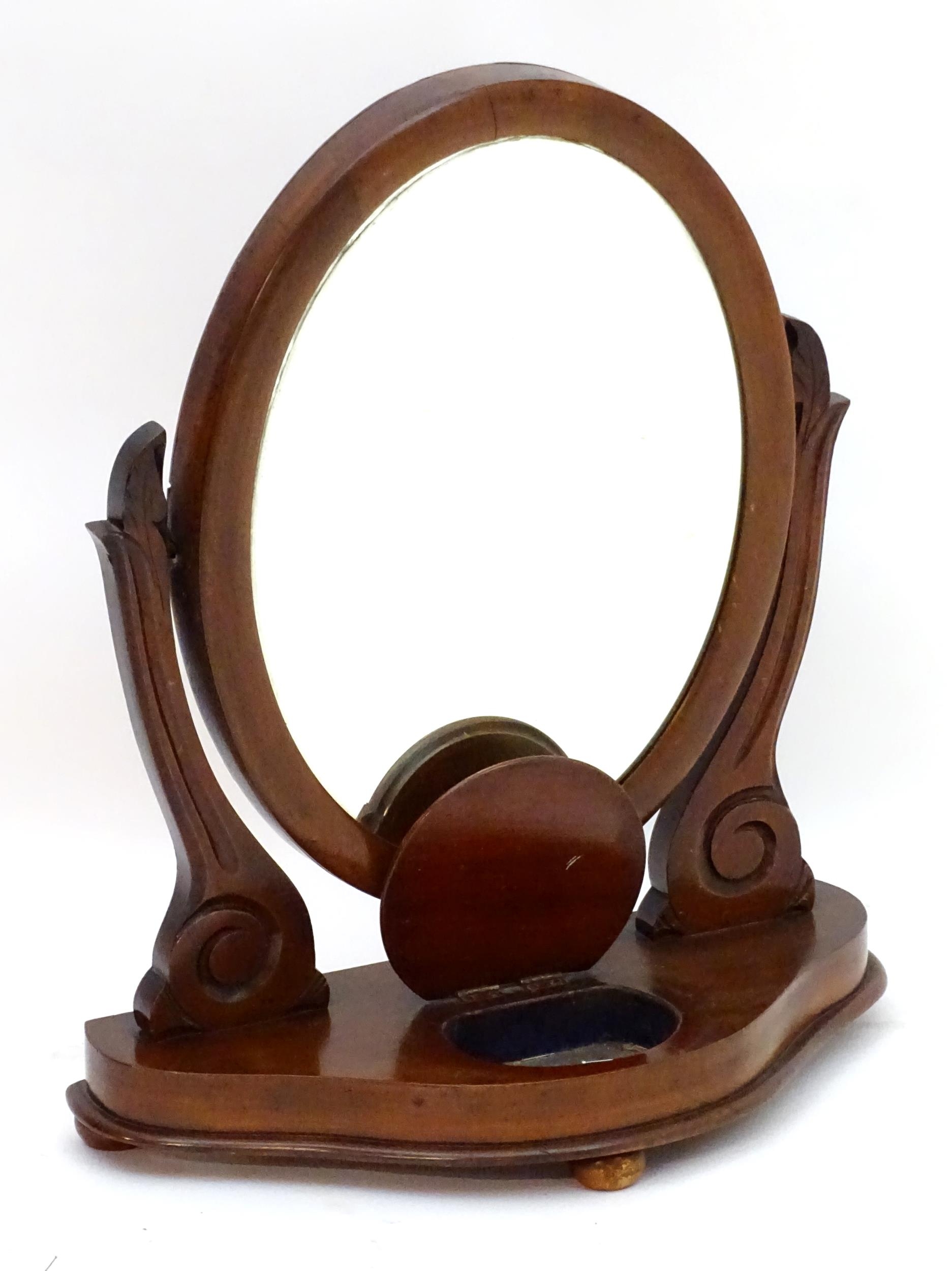 A Victorian mahogany toilet mirror with an oval mirror and shaped surrounds above a moulded base - Image 4 of 6