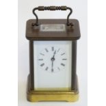 A 20thC 5-glass brass carriage clock. Approx 5 1/2" high overall Please Note - we do not make