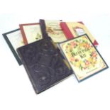 A quantity of albums to include a Victorian leather bound photograph album with arch mounts, a 20thC