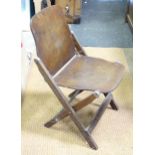 A mid 20thC folding campaign style chair, stamped US B Northern Furniture Co. Approx. 29 1/4" high x
