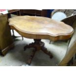 A Victorian walnut centre table with two drawers on a quatreform pedestal base. Approx. 28" high x