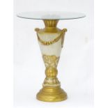 Glass topped occasional table, the pedestal base of urn form with gilt decoration. Standing 25 1/