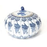 A Chinese blue and white pot and cover of stylised gourd / pumpkin form decorated with banded vine
