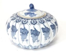 A Chinese blue and white pot and cover of stylised gourd / pumpkin form decorated with banded vine