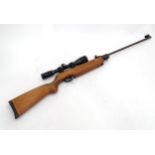 A Weihrauch HW35 model .22 air rifle, fitted with a Nikko Stirling 4-12x14 telescopic sight,