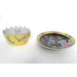 A Japanese plate with hand painted decoration depicting two exotic birds amongst flowers. Together