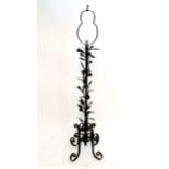 A wrought iron standard lamp. Approx. 66 1/22 high Please Note - we do not make reference to the