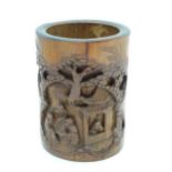 An Oriental bamboo brush pot with carved detail depicting 4 sage figures. Approx 7" high Please Note