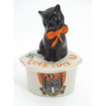 A Carlton China crested ware model of a cat on a plinth for Swansea. Approx. 3 1/2" high Please Note