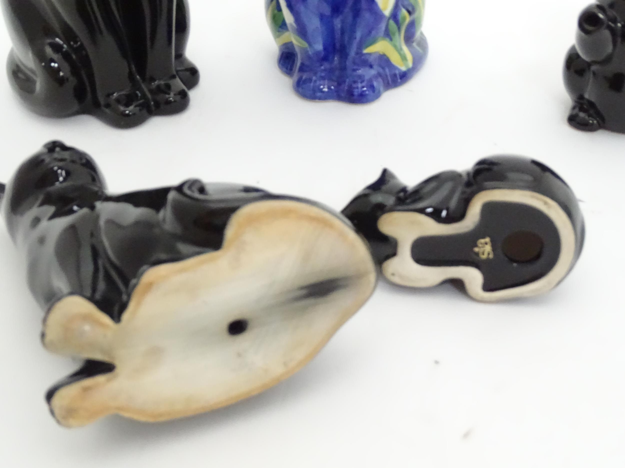 Four ceramic models of cats, together with a small novelty teapot modelled as a black cat. Largest - Image 3 of 4