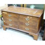 A 20thC mahogany lowboy with two flights of three drawers and a brushing slide. Approx. 38" wide x