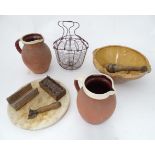 Assorted kitchenalia items to include a terracotta mixing bowl with spout, Bread board, egg