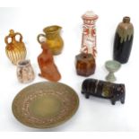 A quantity of assorted studio pottery wares to include slipware jugs, pots, charger, figures, etc.