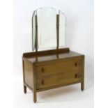 An Art Deco oak dressing table with a triptych mirror. Approx. 58" high x 38 1/4" wide x 19" ding