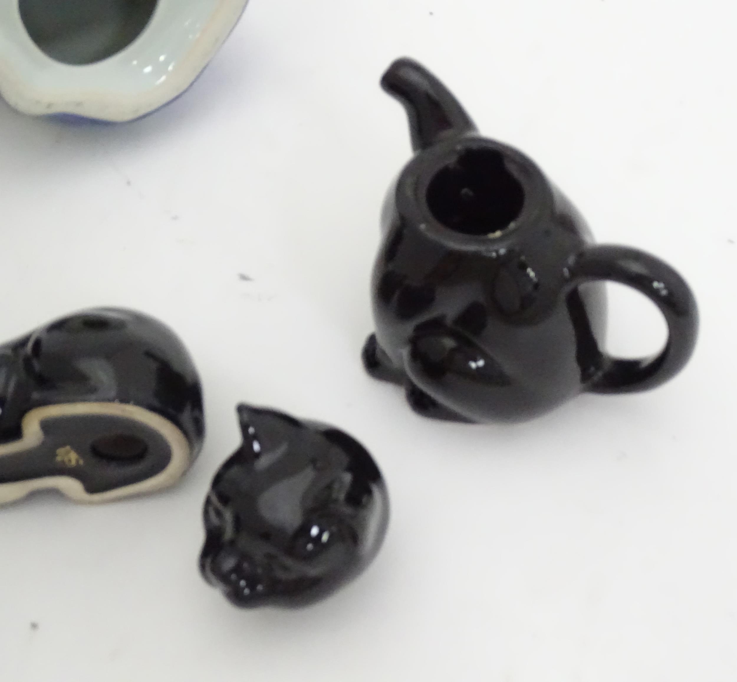 Four ceramic models of cats, together with a small novelty teapot modelled as a black cat. Largest - Image 2 of 4