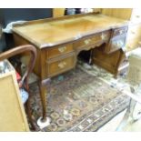 A 20thC mahogany desk with inverted breakfront top, five drawers and cabriole legs. Approx. 46" wide