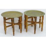 A pair of early 20thC brass top tables with incised tray tops and painted folding bases. 21 1/4"