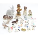 A quantity of assorted ceramics model animals to include cats, dogs, chickens, etc. Please Note - we