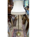 A 20thC brass standard lamp with twist column and fabric shade. Approx. 63 1/2" high Please Note -